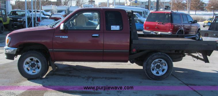 image for item E5875 1997 Toyota T100 DX Xtracab flatbed pickup truck