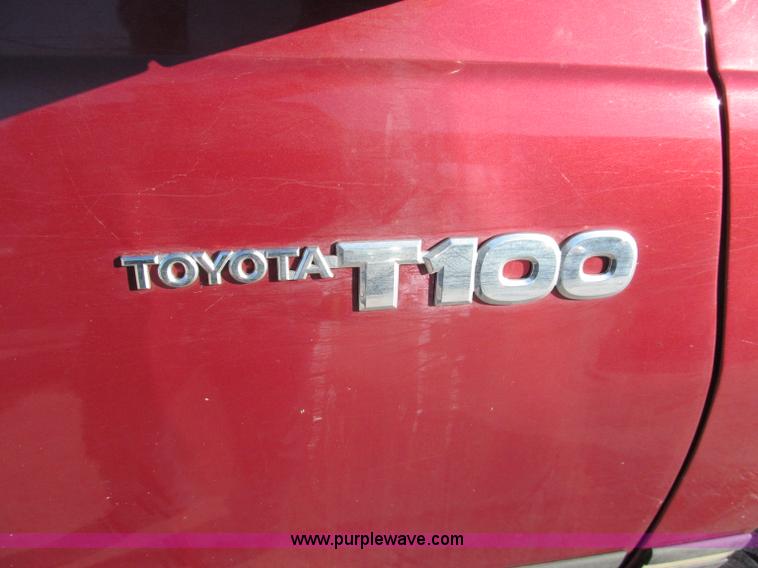 image for item E5875 1997 Toyota T100 DX Xtracab flatbed pickup truck