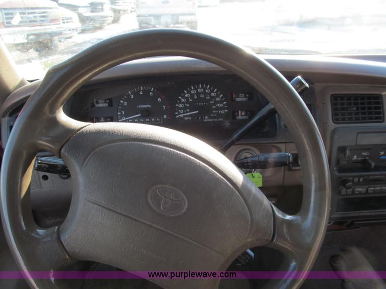 image for item E5875 1997 Toyota T100 DX Xtracab flatbed pickup truck