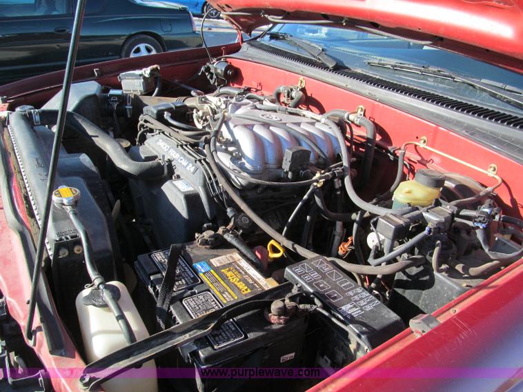 image for item E5875 1997 Toyota T100 DX Xtracab flatbed pickup truck