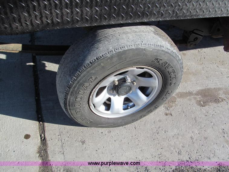 image for item E5875 1997 Toyota T100 DX Xtracab flatbed pickup truck