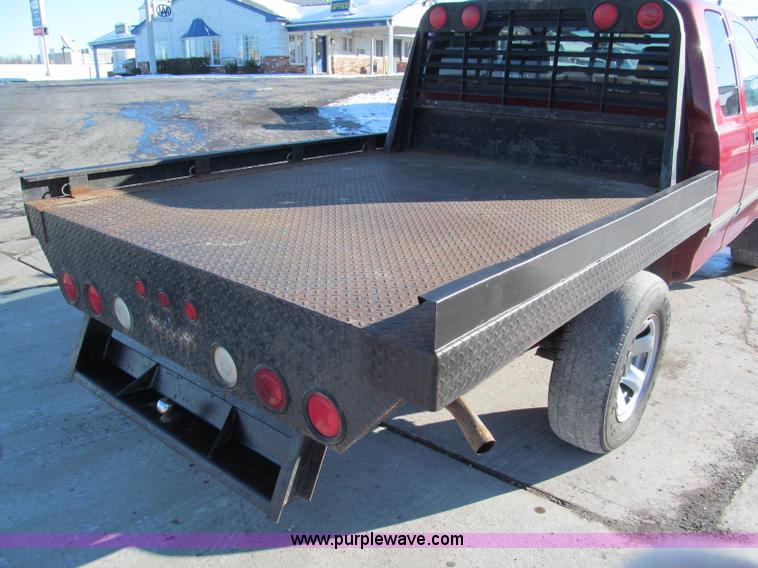 image for item E5875 1997 Toyota T100 DX Xtracab flatbed pickup truck