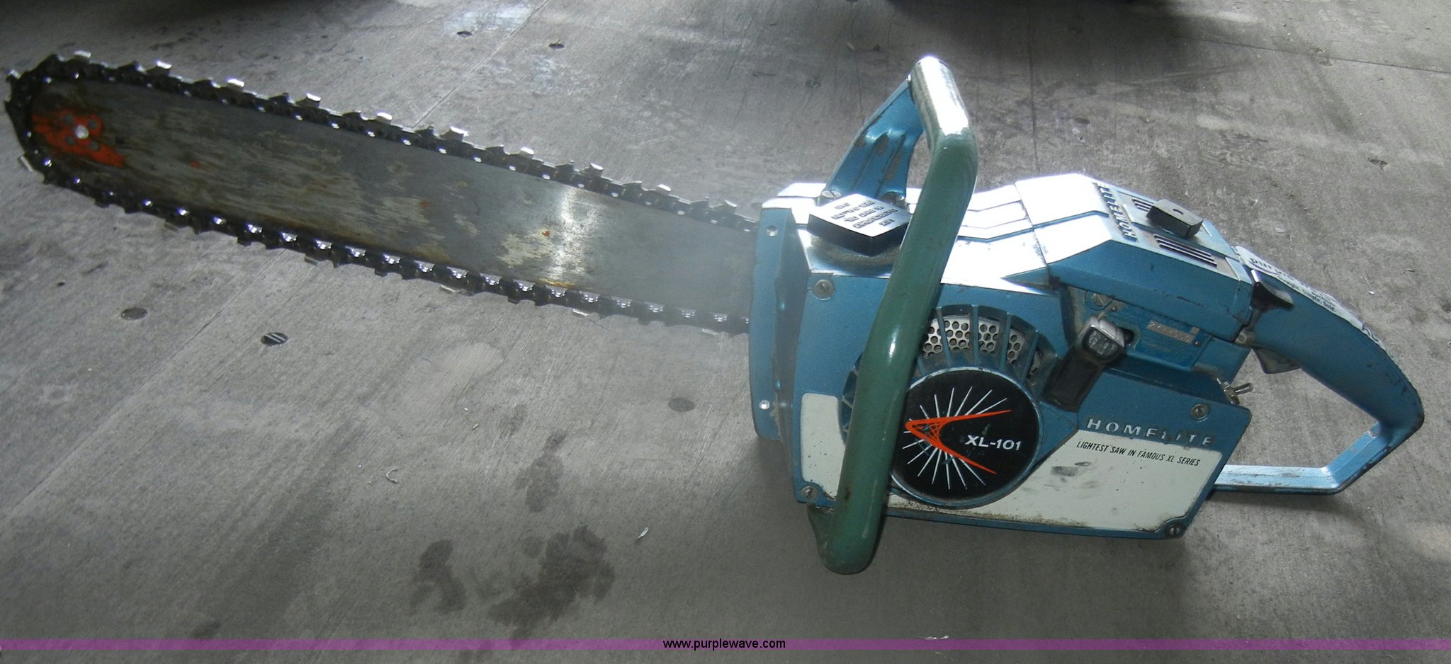 Homelite XL101 chainsaw in Topeka, KS Item AB9804 sold Purple Wave