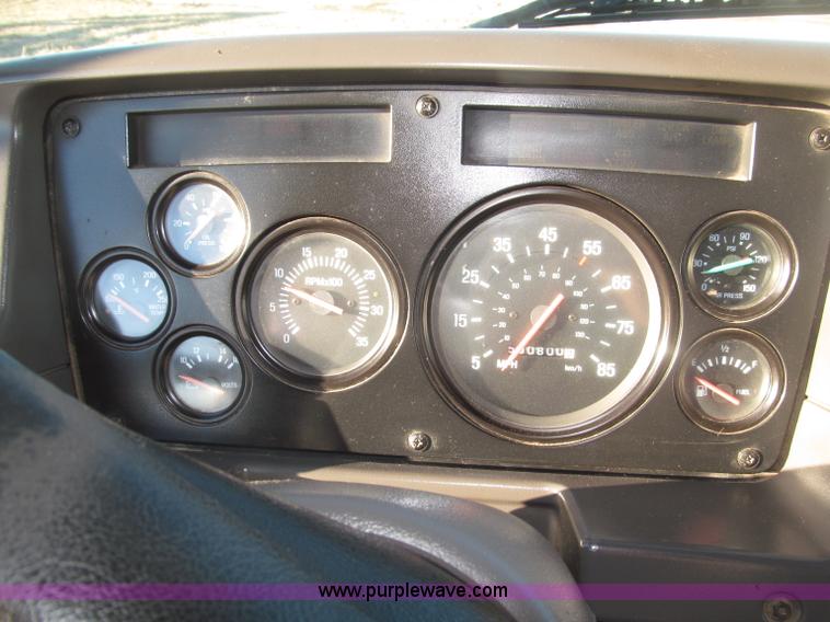 image for item B5332 1998 Ford LT9511 tri axle dump truck