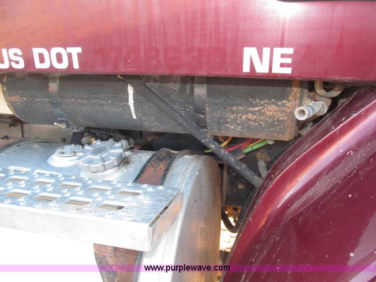 image for item B5332 1998 Ford LT9511 tri axle dump truck