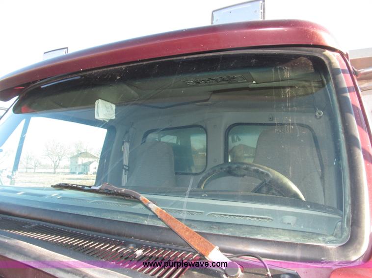 image for item B5332 1998 Ford LT9511 tri axle dump truck