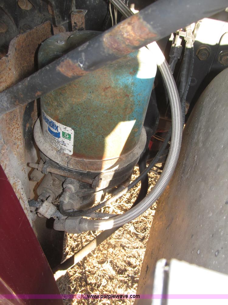 image for item B5332 1998 Ford LT9511 tri axle dump truck