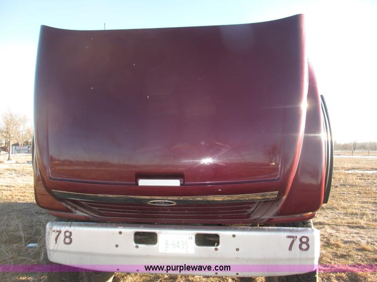 image for item B5332 1998 Ford LT9511 tri axle dump truck