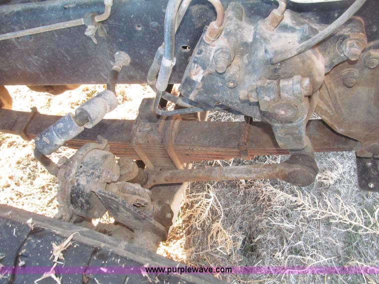 image for item B5332 1998 Ford LT9511 tri axle dump truck