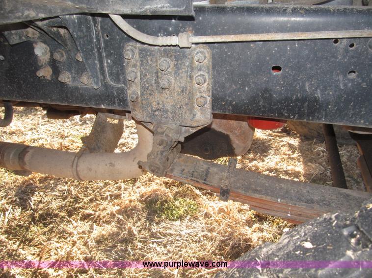 image for item B5332 1998 Ford LT9511 tri axle dump truck