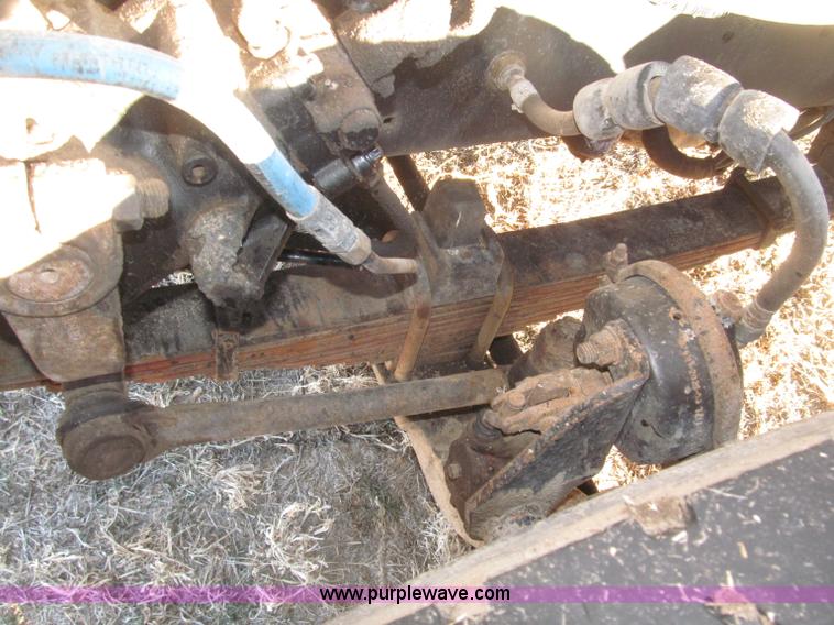 image for item B5332 1998 Ford LT9511 tri axle dump truck