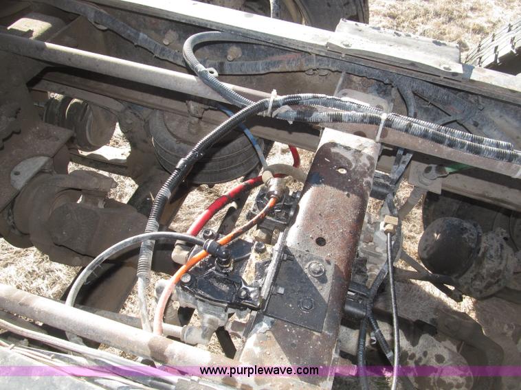 image for item B5332 1998 Ford LT9511 tri axle dump truck