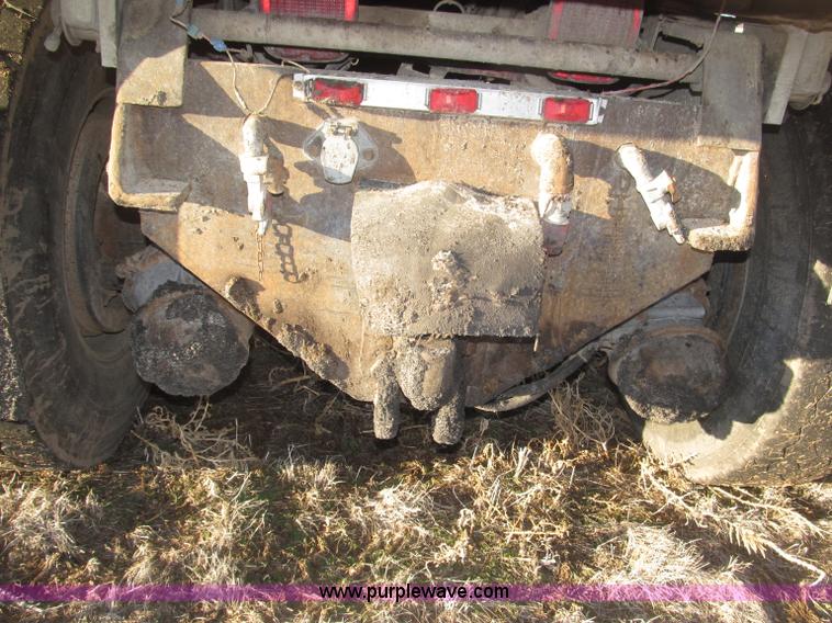 image for item B5332 1998 Ford LT9511 tri axle dump truck