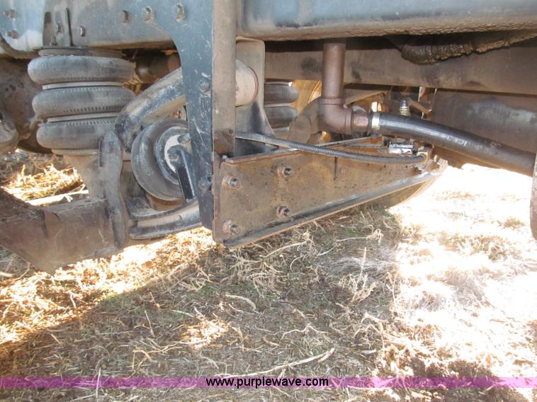 image for item B5332 1998 Ford LT9511 tri axle dump truck