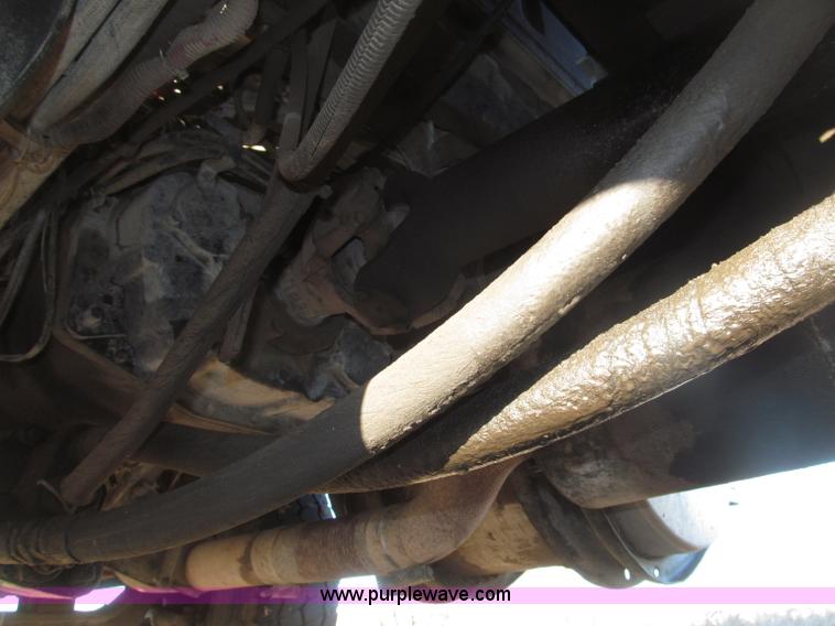 image for item B5332 1998 Ford LT9511 tri axle dump truck