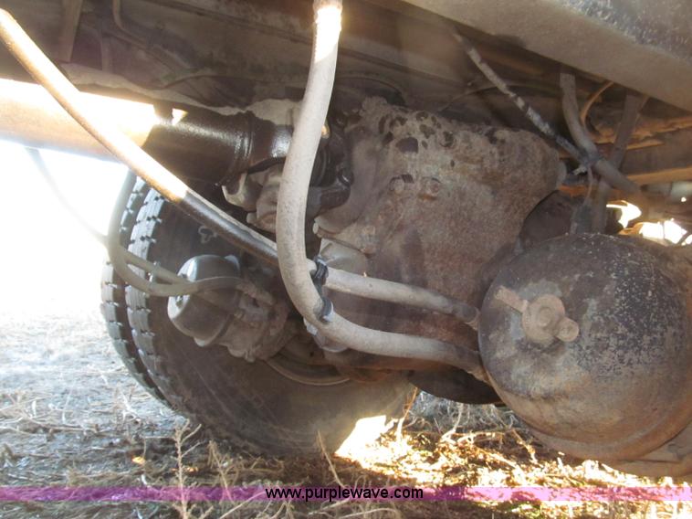 image for item B5332 1998 Ford LT9511 tri axle dump truck