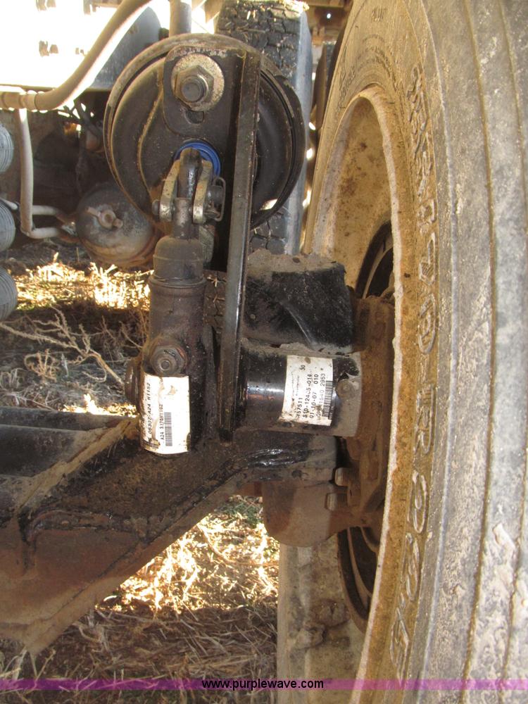 image for item B5332 1998 Ford LT9511 tri axle dump truck