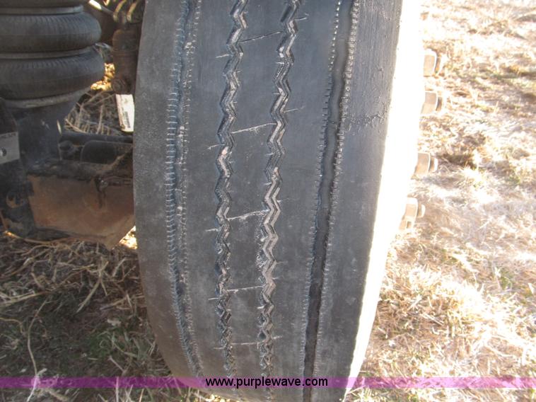 image for item B5332 1998 Ford LT9511 tri axle dump truck