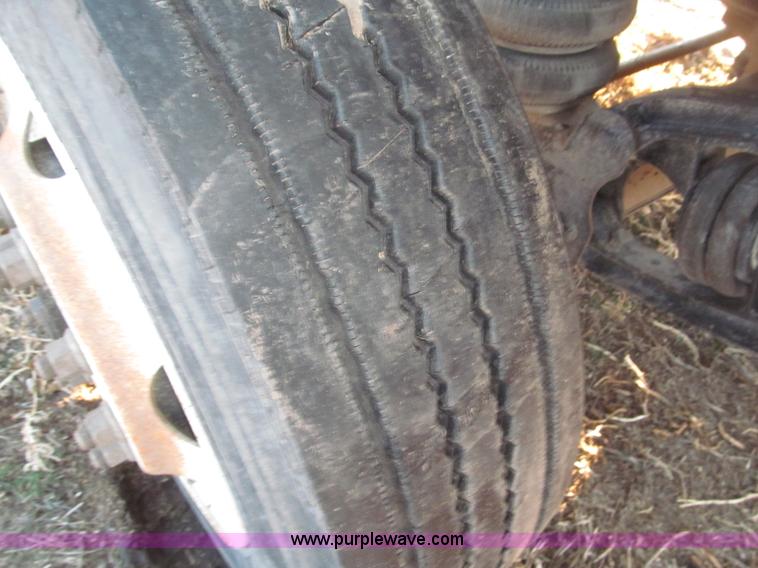 image for item B5332 1998 Ford LT9511 tri axle dump truck