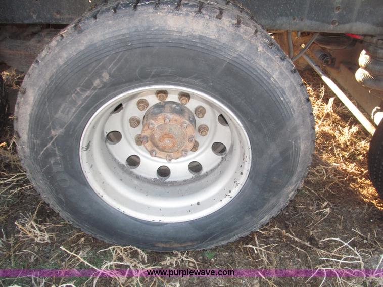 image for item B5332 1998 Ford LT9511 tri axle dump truck