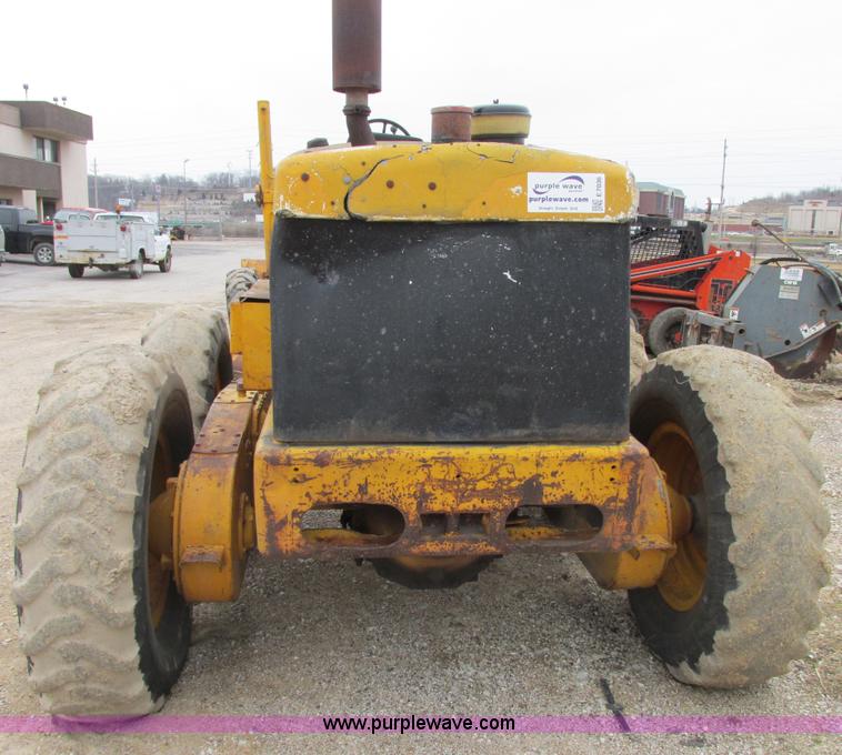 image for item E7036 John Deere 570A articulated motor grader