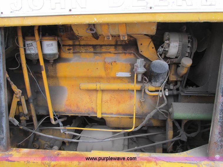 image for item E7036 John Deere 570A articulated motor grader