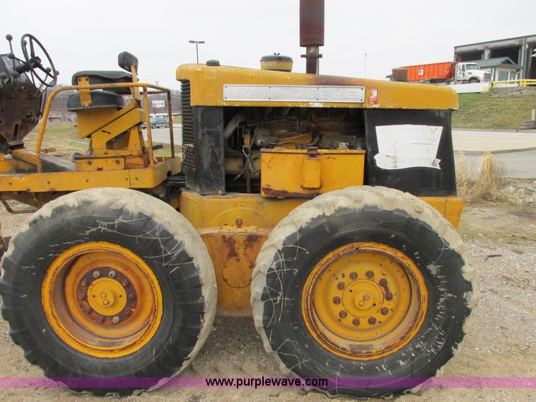 image for item E7036 John Deere 570A articulated motor grader
