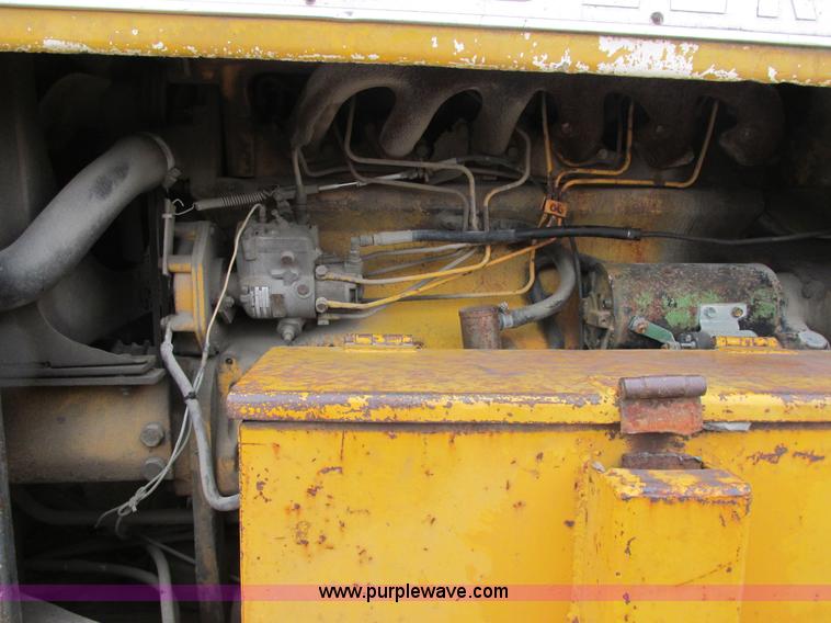 image for item E7036 John Deere 570A articulated motor grader