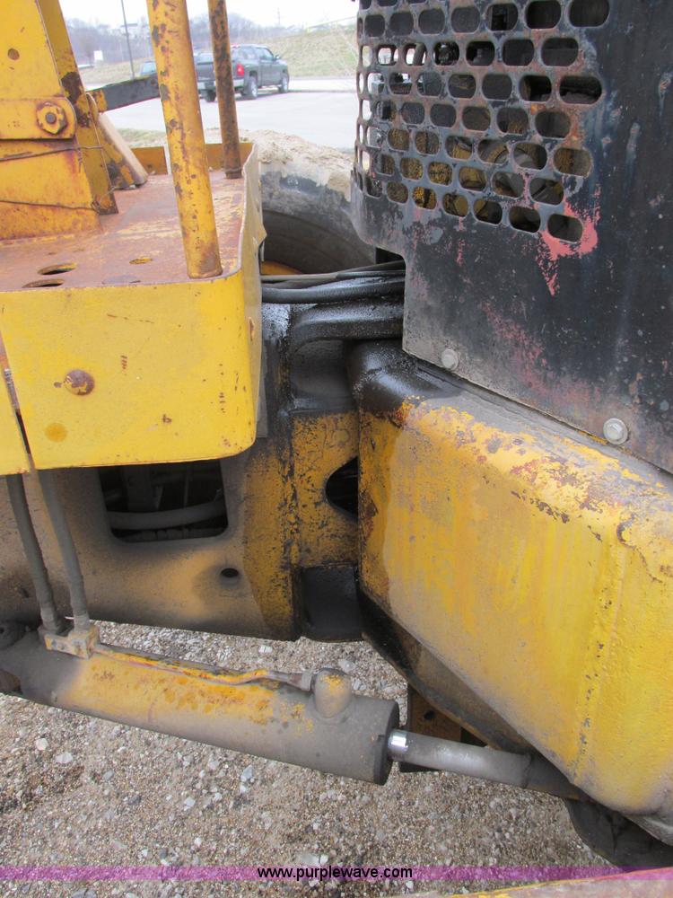 image for item E7036 John Deere 570A articulated motor grader