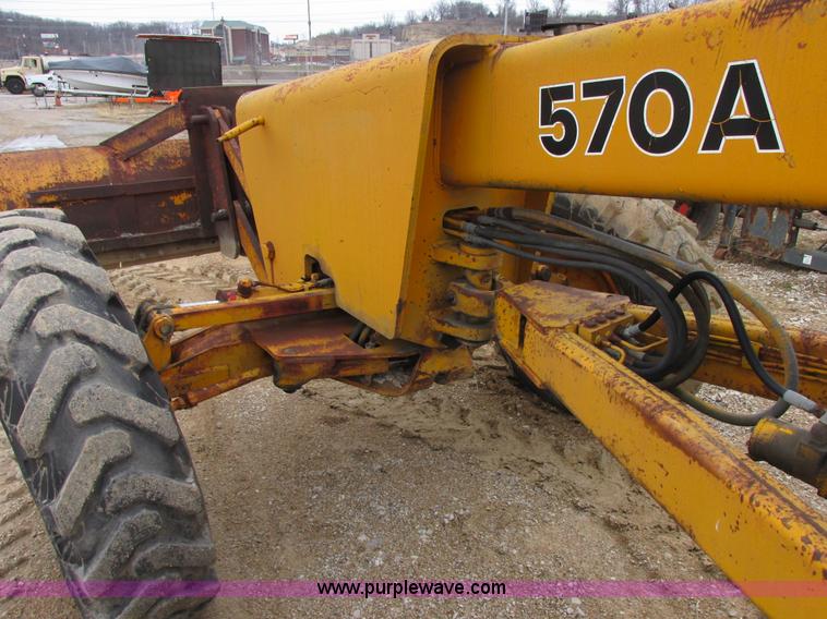 image for item E7036 John Deere 570A articulated motor grader