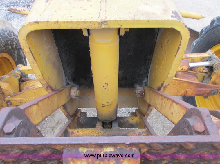 image for item E7036 John Deere 570A articulated motor grader