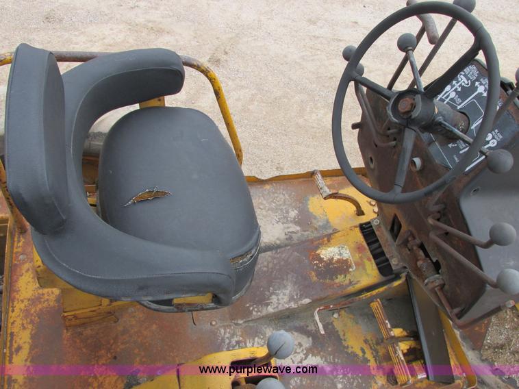 image for item E7036 John Deere 570A articulated motor grader