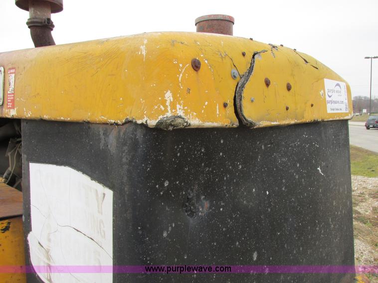 image for item E7036 John Deere 570A articulated motor grader