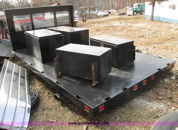 image for item F4220 12.5' flatbed with dump hoist