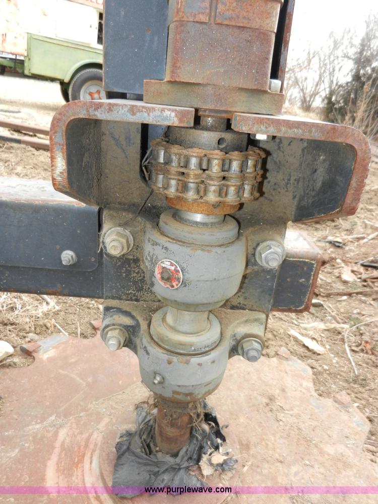 image for item AB9599 Brown brush saw skid steer attachment