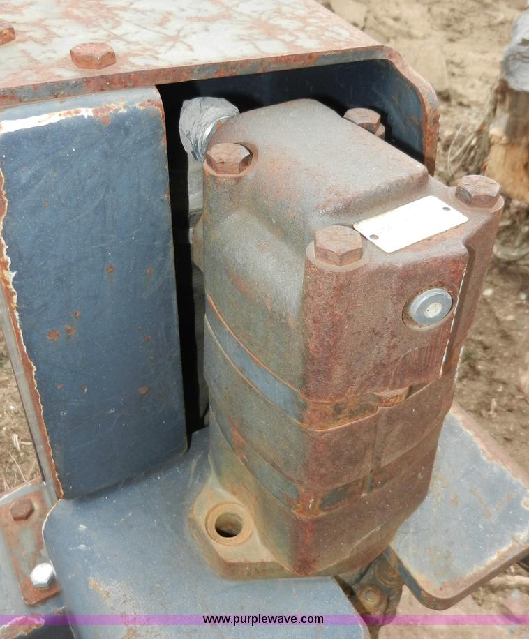 image for item AB9599 Brown brush saw skid steer attachment