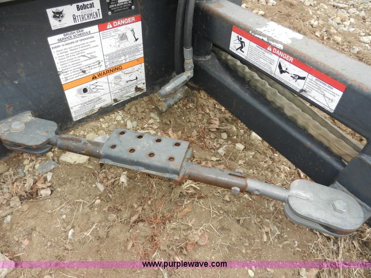 image for item AB9599 Brown brush saw skid steer attachment