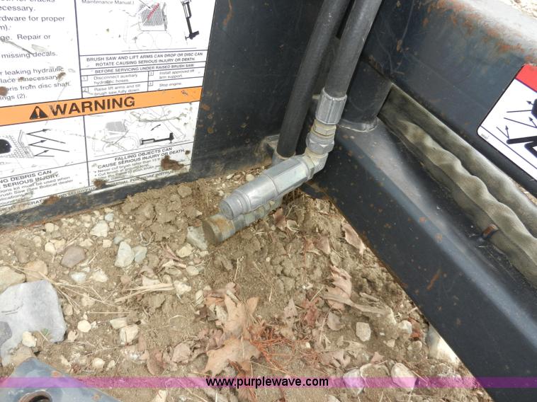 image for item AB9599 Brown brush saw skid steer attachment