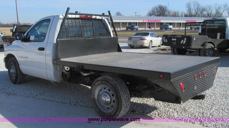 image for item E3680 2003 Dodge Ram 2500 flatbed truck