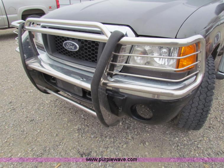 image for item E8291 2004 Ford Ranger XLT SuperCab flatbed pickup truck
