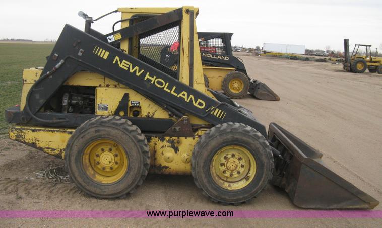 image for item E3024 New Holland L785 skid steer