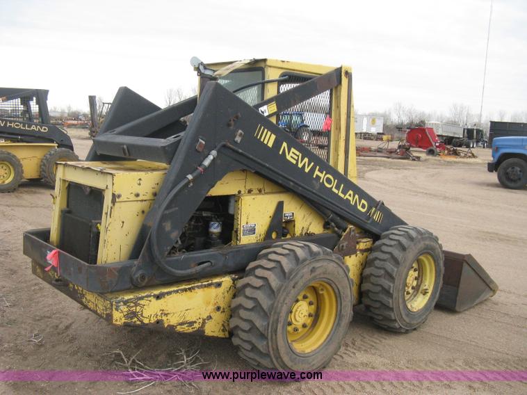 image for item E3024 New Holland L785 skid steer