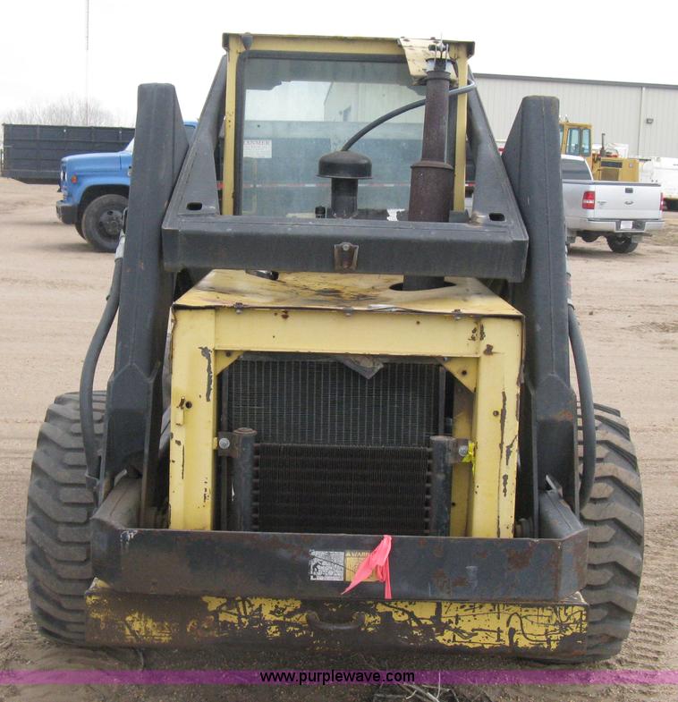 image for item E3024 New Holland L785 skid steer