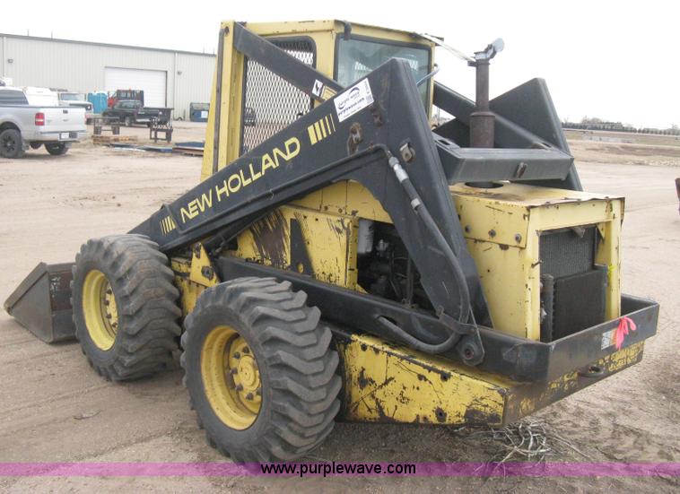 image for item E3024 New Holland L785 skid steer
