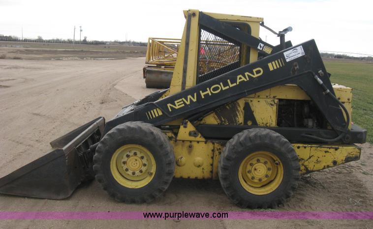 image for item E3024 New Holland L785 skid steer