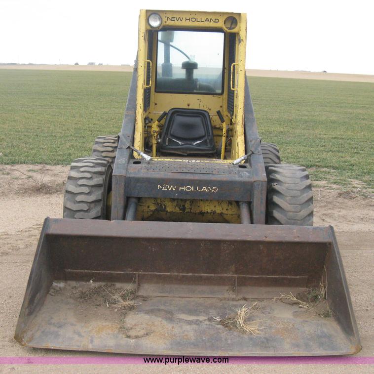 image for item E3024 New Holland L785 skid steer