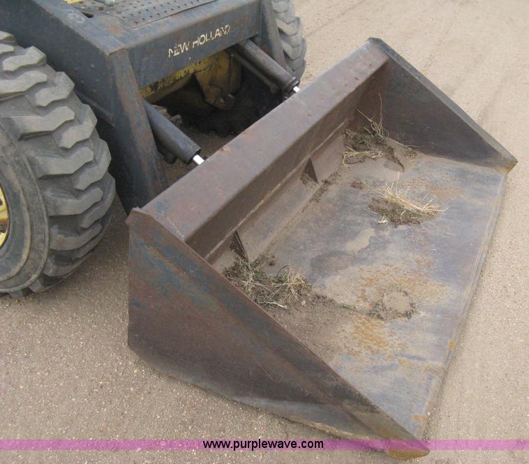 image for item E3024 New Holland L785 skid steer