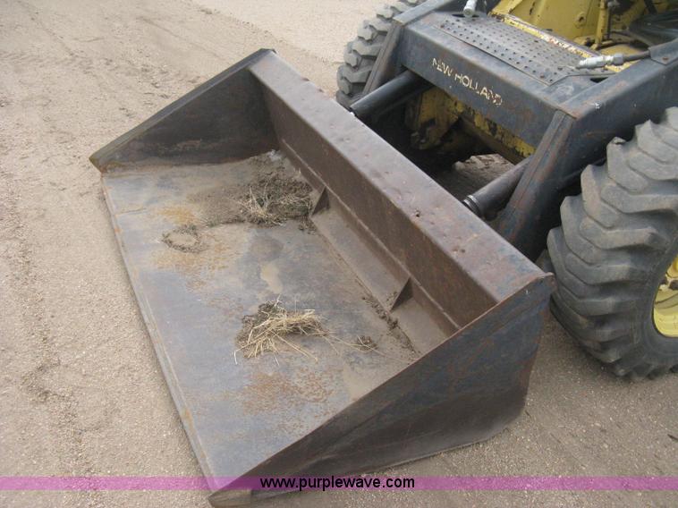 image for item E3024 New Holland L785 skid steer