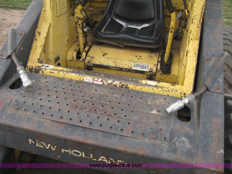 image for item E3024 New Holland L785 skid steer