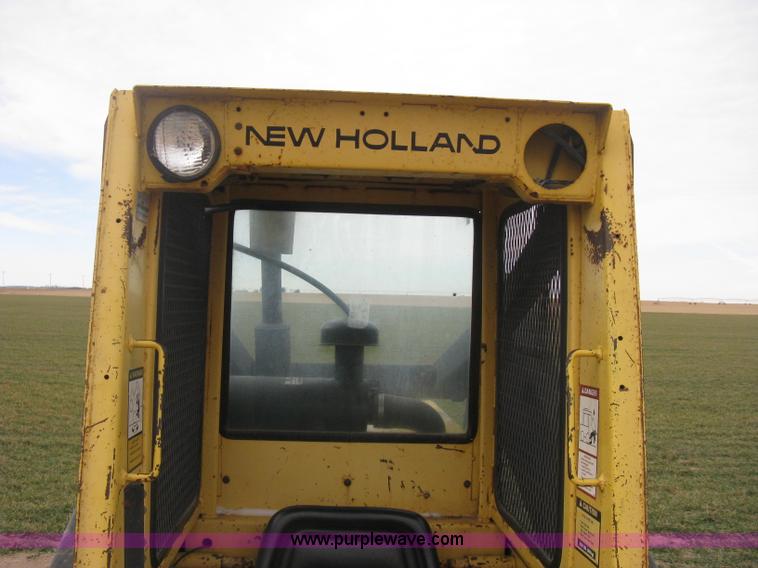 image for item E3024 New Holland L785 skid steer